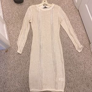 Gold tone knitted dress. 90% viscose 10% nylon. Semi sheer.